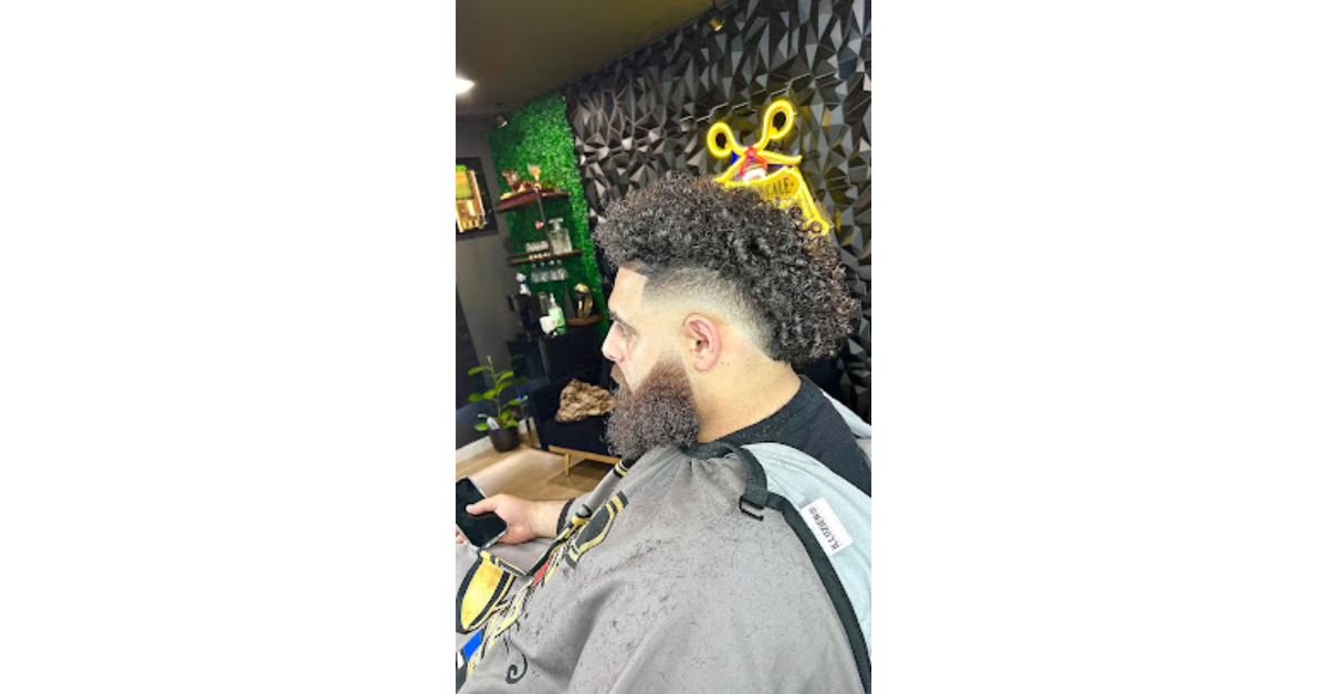 Premium barber in Antioch giving fade haircut and beard grooming at Upper Scale Barber Lounge