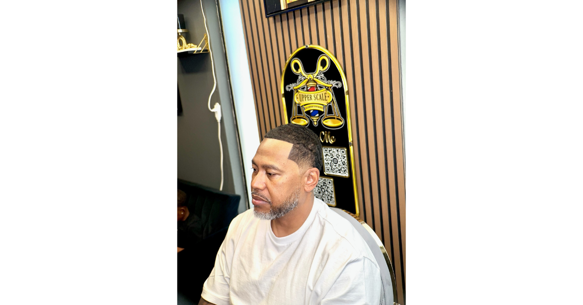 Professional men's haircut with a fresh skin fade demonstrating the ideal haircut frequency men should follow to maintain a clean and polished appearance.
