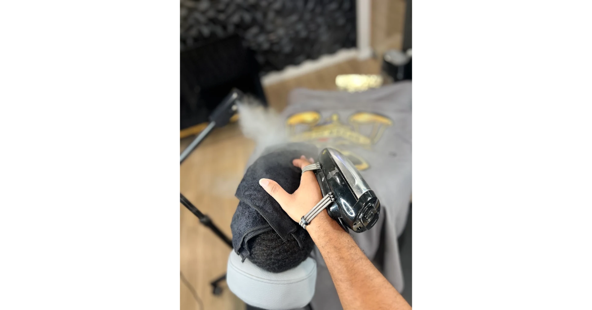 Professional hot towel treatment before beard grooming at Upper Scale Barber Lounge in Antioch, CA.