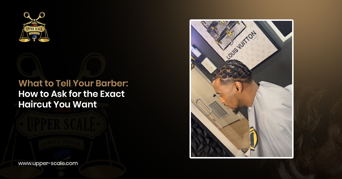 Barber consulting with a male client about haircut length, fade style, and desired finished look.